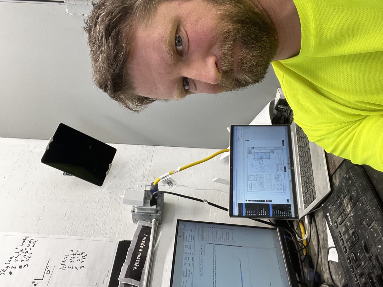 Jeff Luberski reviewing construction documents and blueprints